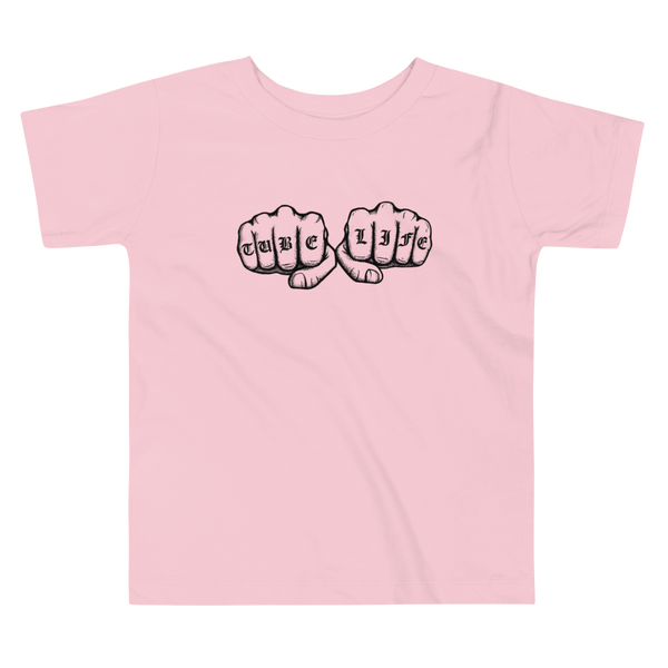 An old English knuckle tattoo that says "tube life" - for living the gtube and trach life with a stoma on a pink kids t-shirt.