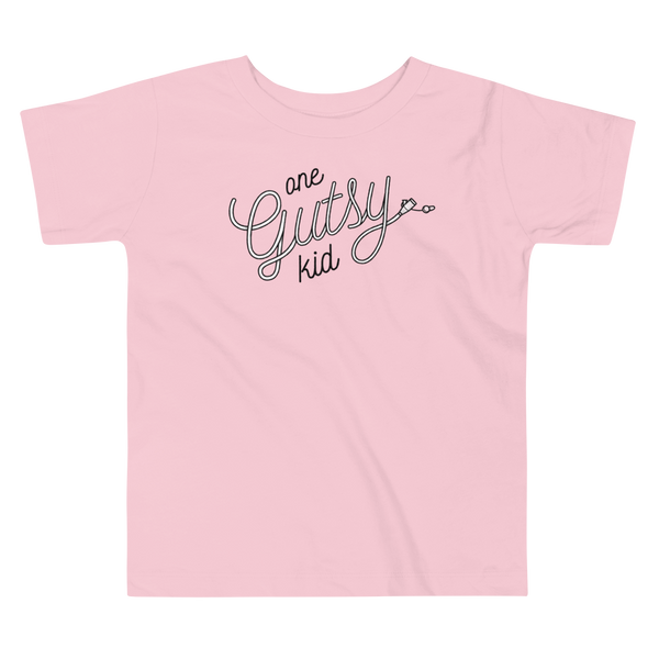 Script text that says one gutsy kid out of a g-tube or feeding tube in the stoma for a tubie life by StomaStoma on a pink kids t-shirt.