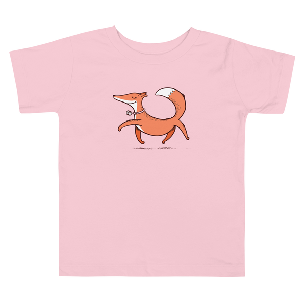 A confident orange and white fox with a trach or tracheostomy and HME for humidification via stoma trots on a pink kids t-shirt