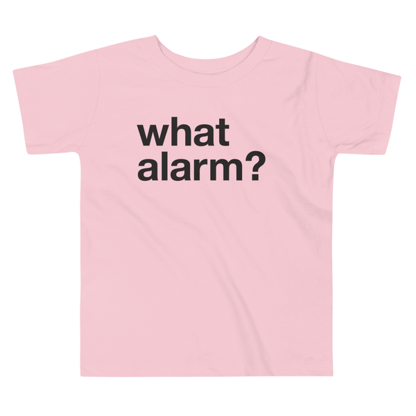 Black text left justified that simply says what alarm? on a pink kids t-shirt.