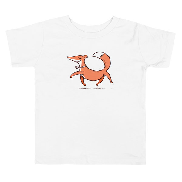A confident orange and white fox with a trach or tracheostomy and HME for humidification via stoma trots on a white kids t-shirt