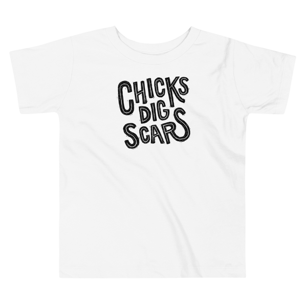 Black textured and distressed hand lettered typography that says chicks dig scars for those with a trach, g-tube or stoma on a kids white t-shirt