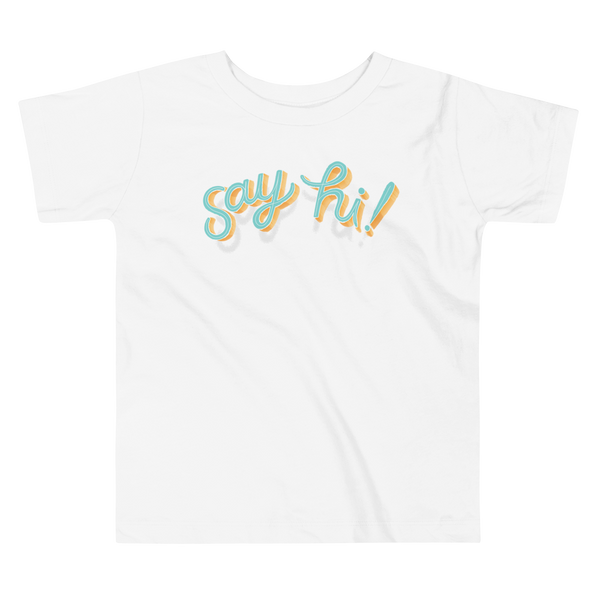 Floating script text "say hi!" on an white kids t-shirt.